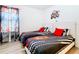 Bedroom with twin beds, Cars themed bedding, and ample closet space at 1610 Lima Ave, Kissimmee, FL 34747