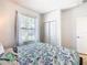 Bedroom with a queen bed and plenty of natural light at 1610 Lima Ave, Kissimmee, FL 34747