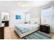 Bright bedroom with a queen bed and en-suite bathroom at 1610 Lima Ave, Kissimmee, FL 34747