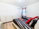 Bright bedroom with twin beds, dresser, and Cars themed bedding at 1610 Lima Ave, Kissimmee, FL 34747
