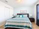Main bedroom with striped bedding and nightstands at 1610 Lima Ave, Kissimmee, FL 34747