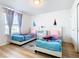 ' bedroom with two twin beds and Frozen decor at 1610 Lima Ave, Kissimmee, FL 34747