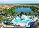 Large community pool with water features and lounge area at 1610 Lima Ave, Kissimmee, FL 34747