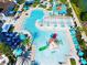 Expansive pool area with water slide and lounge chairs at 1610 Lima Ave, Kissimmee, FL 34747
