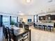 Open concept dining area with a large table and access to the patio at 1610 Lima Ave, Kissimmee, FL 34747