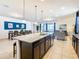 Spacious kitchen with an island and granite countertops at 1610 Lima Ave, Kissimmee, FL 34747