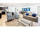 Spacious living room with seating and view into dining area at 1610 Lima Ave, Kissimmee, FL 34747