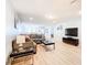 Spacious living room featuring a sectional sofa, coffee table, and large TV at 1610 Lima Ave, Kissimmee, FL 34747