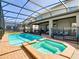 Enjoy this screened pool and spa; your own backyard retreat at 1610 Lima Ave, Kissimmee, FL 34747