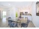 Kitchen features a glass dining table with gray velvet chairs at 1811 Coriander Dr, Kissimmee, FL 34759