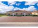 Front view of a two-unit building with brick pavers and landscaping at 1811 Coriander Dr, Kissimmee, FL 34759