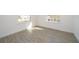 Bright and airy office space with wood-look flooring and large windows at 1853 Coriander Dr, Kissimmee, FL 34759