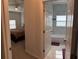 View of bedroom and bathroom with carpet flooring at 19 James Ct, Davenport, FL 33837