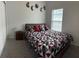 Cozy bedroom with neutral walls, plush carpet, and natural light from a window with blinds at 19 James Ct, Davenport, FL 33837