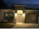 Charming home with an attached garage, freshly cut grass, and inviting entryway with exterior lighting at 19 James Ct, Davenport, FL 33837