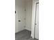 Interior view of a room with white doors and grey flooring at 217 W Chelsea St, Deland, FL 32720