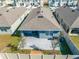 Aerial view showcasing a house with backyard patio and surrounding neighborhood at 2265 Tay Wes Dr, St Cloud, FL 34771