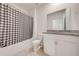 Bathroom with a shower/tub combo, granite countertop, and white cabinets at 2265 Tay Wes Dr, St Cloud, FL 34771
