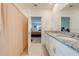 Main bathroom with double vanity and access to bedroom at 2265 Tay Wes Dr, St Cloud, FL 34771