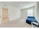 Spacious bedroom with a daybed, window, and access to a hallway at 2265 Tay Wes Dr, St Cloud, FL 34771