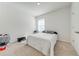Bright bedroom with carpeted floor, window, and a queen-size bed at 2265 Tay Wes Dr, St Cloud, FL 34771