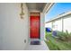 Inviting red front door entryway leading into a spacious foyer at 2265 Tay Wes Dr, St Cloud, FL 34771