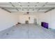 Attached garage with white walls and open door at 2265 Tay Wes Dr, St Cloud, FL 34771