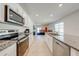 Open concept kitchen with stainless steel appliances and granite countertops at 2265 Tay Wes Dr, St Cloud, FL 34771
