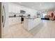Modern kitchen with white cabinets, granite countertops, and stainless steel appliances at 2265 Tay Wes Dr, St Cloud, FL 34771