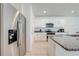 Modern kitchen with stainless steel refrigerator and granite countertops at 2265 Tay Wes Dr, St Cloud, FL 34771