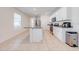 Modern kitchen featuring white shaker cabinets, granite countertops, and a large island at 2265 Tay Wes Dr, St Cloud, FL 34771