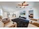 Open concept living room with a view into the kitchen and bedroom at 2265 Tay Wes Dr, St Cloud, FL 34771