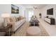 Spacious living room with neutral colored furniture and large TV at 2265 Tay Wes Dr, St Cloud, FL 34771