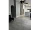 Open-concept living room with tile floors, neutral walls, and arched doorways at 228 Remington Pl, Haines City, FL 33844