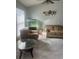 Cozy living room with large windows, neutral paint, tile floors, and unique decor at 228 Remington Pl, Haines City, FL 33844