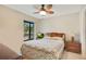 Cozy bedroom with double bed and wood dresser at 2394 Sun Valley Cir # 2394, Winter Park, FL 32792