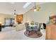 Casual dining area with view into living room and fireplace at 2394 Sun Valley Cir # 2394, Winter Park, FL 32792