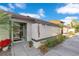 Inviting condo exterior featuring a well-manicured walkway and landscaping at 2394 Sun Valley Cir # 2394, Winter Park, FL 32792