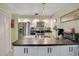 Modern kitchen with stainless steel appliances and an island at 2394 Sun Valley Cir # 2394, Winter Park, FL 32792