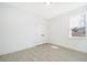 Bright bedroom with wood-look tile floors and double doors at 2571 Sw 153Rd Lane, Ocala, FL 34473