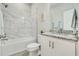 Clean bathroom with a shower/tub combo and granite countertop at 286 Begonia Ln, Kissimmee, FL 34759