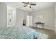 Bright bedroom with a queen bed and ensuite bathroom at 286 Begonia Ln, Kissimmee, FL 34759