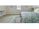 Spacious bedroom with wood-look floors and a large bed at 286 Begonia Ln, Kissimmee, FL 34759
