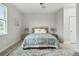 Spacious bedroom with a queen bed and window view at 286 Begonia Ln, Kissimmee, FL 34759