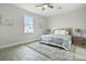 Bedroom with a queen bed and wood flooring at 286 Begonia Ln, Kissimmee, FL 34759