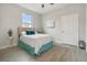 Well lit bedroom with a full bed and teal accents at 286 Begonia Ln, Kissimmee, FL 34759