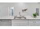 Modern kitchen with granite countertops and stainless steel appliances at 286 Begonia Ln, Kissimmee, FL 34759