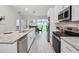 Modern kitchen with granite countertops and stainless steel appliances at 286 Begonia Ln, Kissimmee, FL 34759