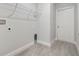 Laundry room with shelving and tile flooring at 286 Begonia Ln, Kissimmee, FL 34759