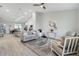 Open living room and kitchen layout with grey couch and modern decor at 286 Begonia Ln, Kissimmee, FL 34759